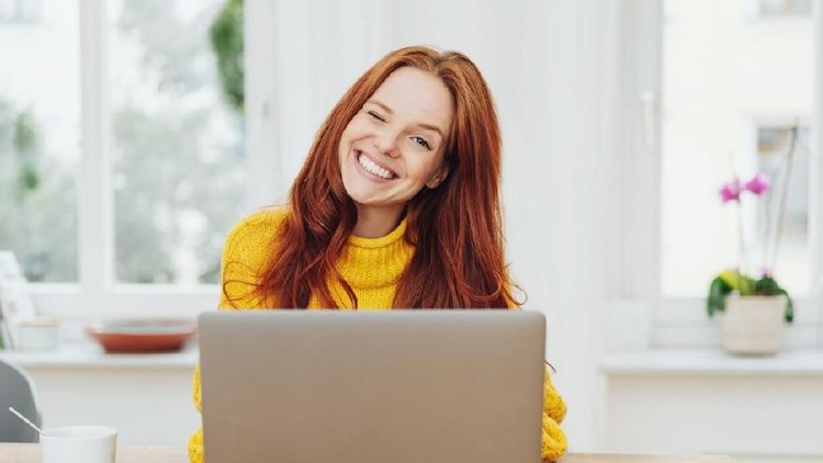 Upset indian female worker sitting at desk in office looking at pc screen feels unhappy and shocked. Millennial hindu woman reading unpleasant notification having system fault and big troubles concept