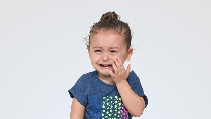 Cute toddler girl crying over white, Studio shot. High resolution image taken with Hasselblad H5D 50c and developed from raw