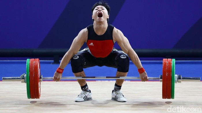 Atlet angkat besi, Rahmat Erwin Abdullah, menambah koleksi medali emas Indonesia di SEA Games 2019 Filipina. Dia menjadi yang terbaik di kelas 73 kg putra.