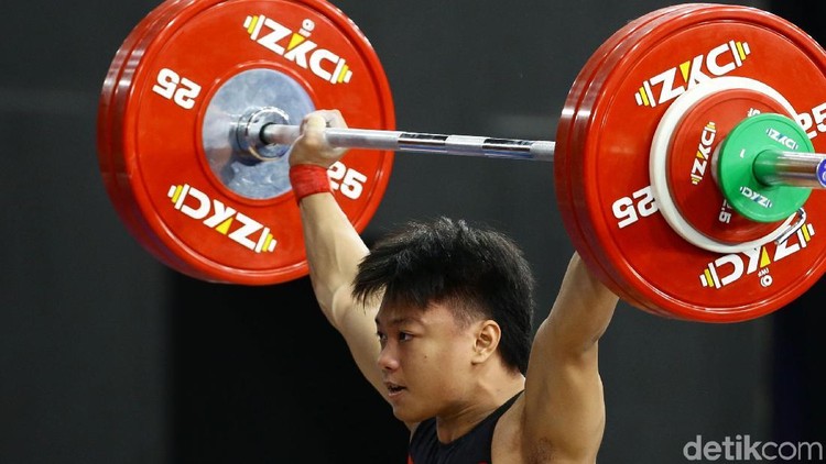 Atlet angkat besi, Rahmat Erwin Abdullah, menambah koleksi medali emas Indonesia di SEA Games 2019 Filipina. Dia menjadi yang terbaik di kelas 73 kg putra.