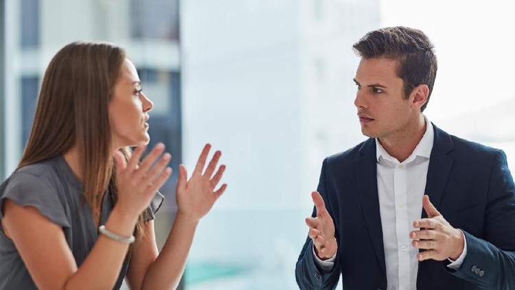 Aged and young women sitting staring at each other with distrust and animosity, focus on millennial girl. Different ages various generations employees conflict fight for company position or leadership