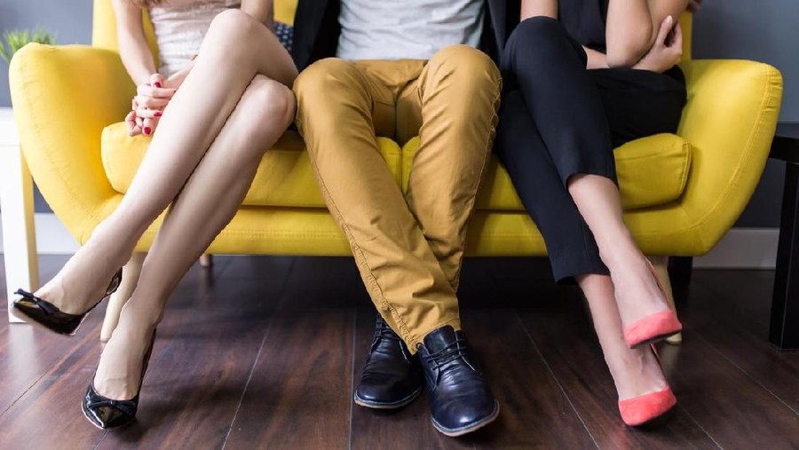 Love triangle, conceptual of a threesome, orgy, swingers or sexual cheating
