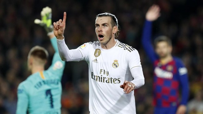 Real Madrid's Gareth Bale reacts during a Spanish La Liga soccer match between Barcelona and Real Madrid at Camp Nou stadium in Barcelona, Spain, Wednesday, Dec. 18, 2019. Thousands of Catalan separatists are planning to protest around and inside Barcelona's Camp Nou Stadium during Wednesday's 