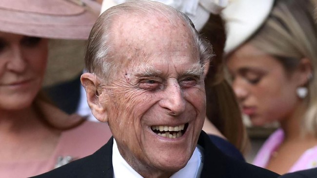 Britain's Prince Philip, Duke of Edinburgh reacts as he talks with Britain's Prince Harry, Duke of Sussex as they leave St George's Chapel in Windsor Castle, Windsor, west of London, on May 18, 2019, after the wedding of Lady Gabriella Windsor and Thomas Kingston. - Lady Gabriella, is the daughter of Prince and Princess Michael of Kent. Prince Michael, is the Queen Elizabeth II's cousin. (Photo by Steve Parsons / POOL / AFP)