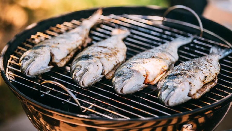 Fish Fried On The Grill Outdoor. Spanish Cuisine
