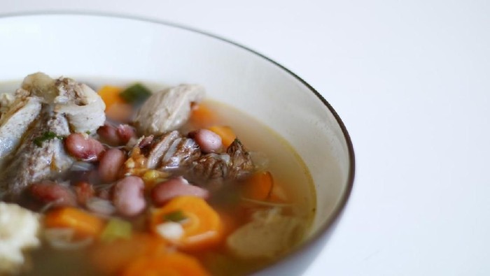 Red kidney bean soup on white background. Indonesian food.