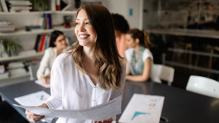 Group of young business people are working together in modern office. Creative people with laptop, tablet, smart phone, notebook. Successful hipster team in coworking. Freelancers.