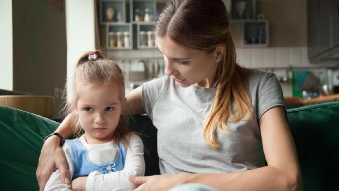 Loving mother consoling or trying make peace with insulted upset stubborn kid daughter avoiding talk, sad sulky resentful girl pouting ignoring caring mom embracing showing support to offended child