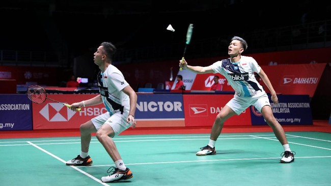 Fenomena persaingan Kevin/Marcus vs Fajar/Rian adalah hal yang paling menarik disoroti dari kegagalan di Malaysia Masters.