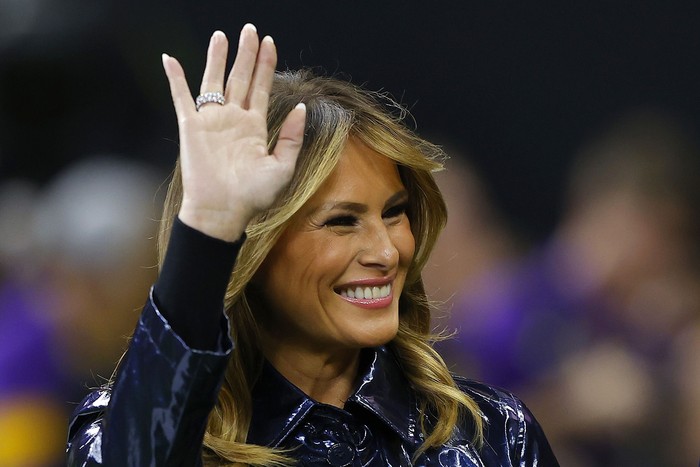 NEW ORLEANS, LOUISIANA - JANUARY 13: (L-R) First Lady Melania Trump and U.S. President Donald Trump wave prior to the College Football Playoff National Championship game between the Clemson Tigers and the LSU Tigers at Mercedes Benz Superdome on January 13, 2020 in New Orleans, Louisiana. (Photo by Kevin C. Cox/Getty Images)