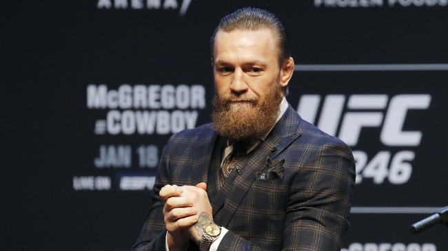 Conor McGregor motions to the crowd during a news conference for a UFC 246 mixed martial arts bout, Wednesday, Jan. 15, 2020, in Las Vegas. McGregor is scheduled to fight Donald 