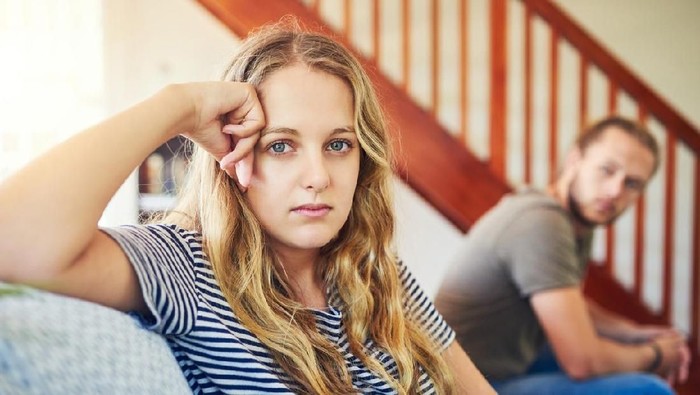 Shot of a young couple having a disagreement at home