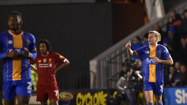 Shrewsbury Town harus berterima kasih kepada Jason Cummings, cadangan yang berhasil membuyarkan kemenangan Liverpool di Piala FA.