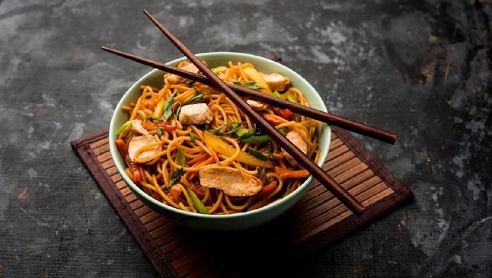 mie or bakmi ayam. seasoned yellow wheat noodles topped with diced chicken meat