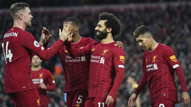 Liverpool's Mohamed Salah, 2nd right, celebrates with teammates after scoring his sides third goal during the English Premier League soccer match between Liverpool and Southampton at Anfield Stadium, Liverpool, England, Saturday, February 1, 2020. (AP Photo/Jon Super)