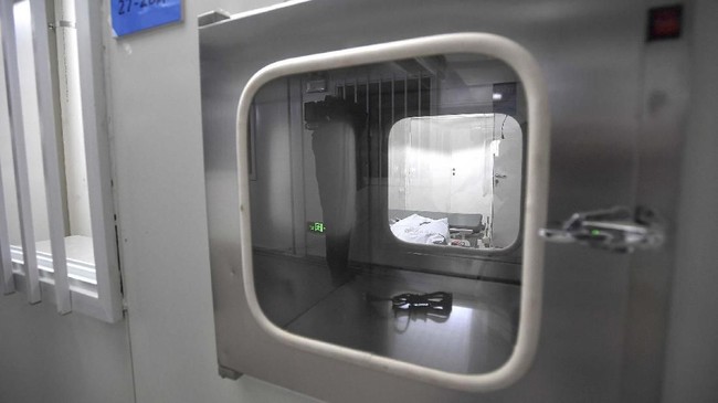 An isolation unit is seen at the Huoshenshan temporary field hospital in Wuhan in central China's Hubei Province, Sunday, Feb. 2, 2020. The Philippines on Sunday reported the first death from a new virus outside of China, where authorities delayed the opening of schools in the worst-hit province and tightened quarantine measures in a city that allow only one family member to venture out to buy supplies. (Chinatopix via AP)