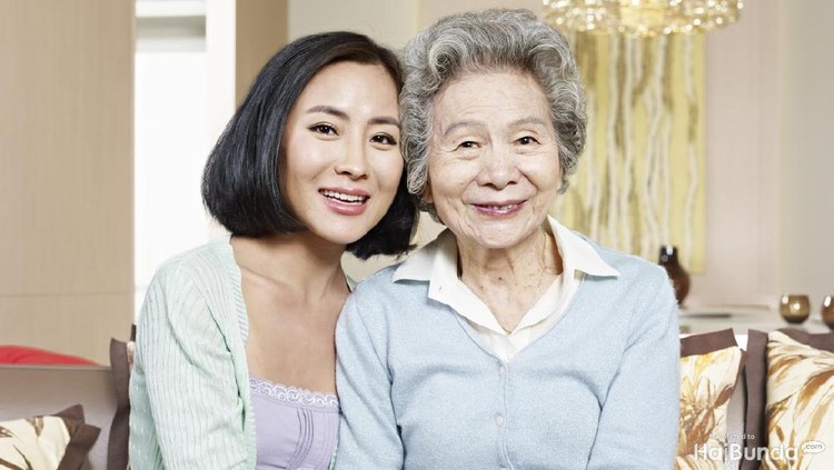 Portrait of happy Young couple and old grandmother