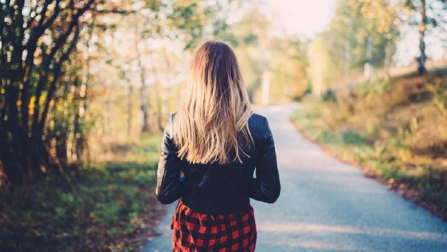 Rear view of woman on a leisure walk among nature