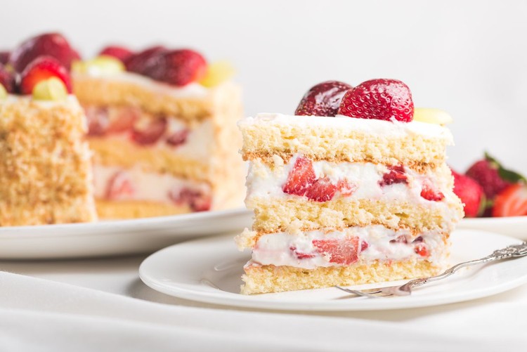1095988370 Sweet strawberry cake on a white tablecloth. delicious homemade food.