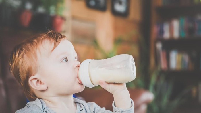Baby Boy drinking Milk Bottle