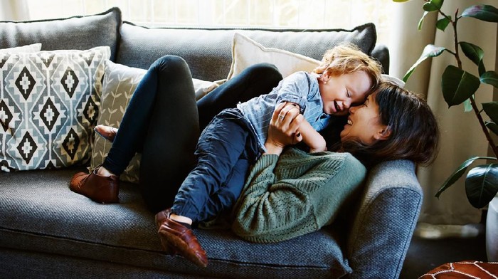 Cropped shot of a young woman spending quality time at home with her son