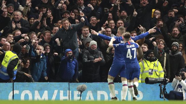 Chelsea's Ross Barkley celebrates after scoring his side's second goal during the English FA Cup fifth round soccer match between Chelsea and Liverpool at Stamford Bridge stadium in London Tuesday, March 3, 2020. (AP Photo/Ian Walton)