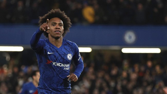 Chelsea's Willian celebrates after scoring his side's opening goal during the English FA Cup fifth round soccer match between Chelsea and Liverpool at Stamford Bridge stadium in London Tuesday, March 3, 2020. (AP Photo/Ian Walton)