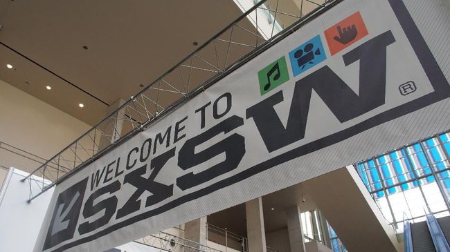 (FILES) In this file photo taken on March 7, 2012 bnners hang in the atrium of the Austin Convention Center, on the eve of the opening of the 27th South By Southwest (SXSW) interactive, film and music festival. - The South by Southwest festival in Texas has been cancelled due to concerns over the spread of the novel coronavirus, organizers and the host city of Austin said on March 6, 2020. 