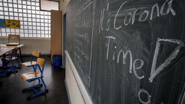 A chalkboard reads 