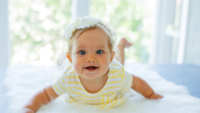 Happy baby girl. Happy little princess.