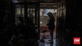 FOTO: Menjaga Sesama dari Balik Tembok Rumah Bekerja dan berdiam diri di rumah menjadi cara yang efektif bagi warga ibu kota untuk mencegah virus corona menyebar luas.