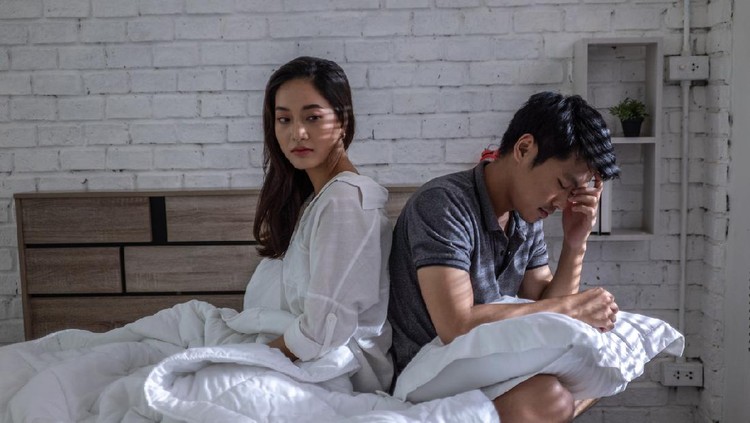 couple Young couple in love lying on bed at home and cuddling, embracing and enjoying weekend together