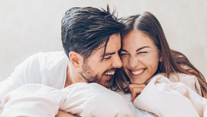 Shot of a young couple sharing an intimate moment in their bedroom