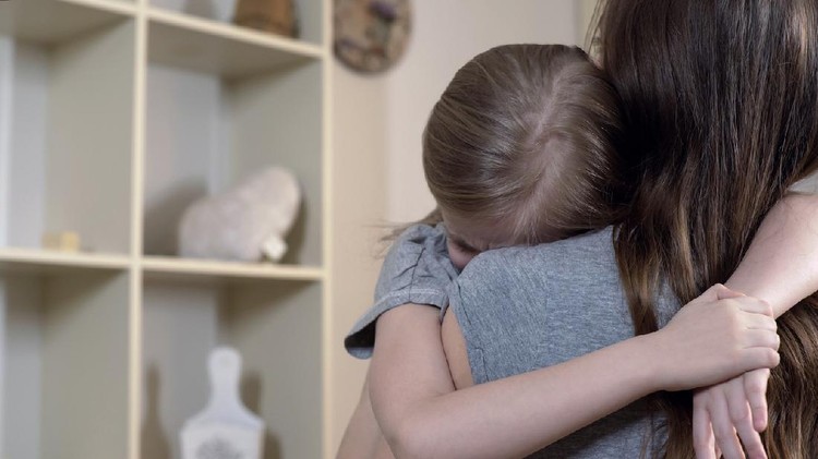 Sad daughter tightly hugging her mother telling about her problems, mother love, stock footage