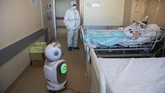 FOTO: Robot Bantu Tenaga Medis di Italia Atasi Corona Sejumlah robot digunakan untuk membantu tenaga medis dan pasien positif virus corona di Italia.