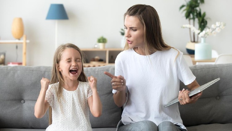 Stubborn little girl scream loud not listening to strict mom, serious young mother scold shouting daughter for bad behavior, working mommy lecture kid yelling asking attention. Family conflict concept