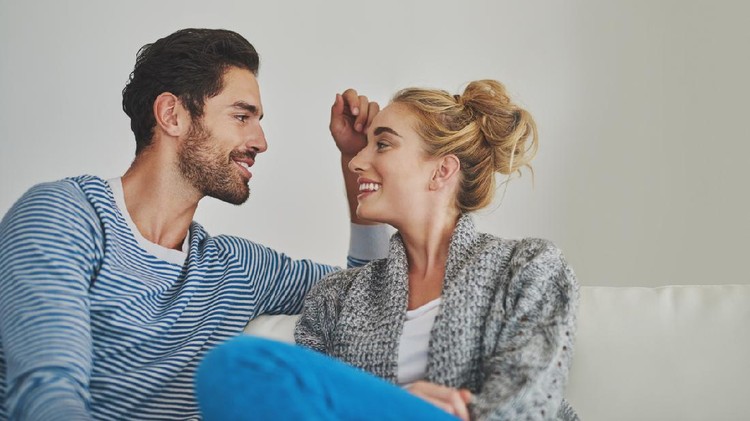 520496496 Shot of a young couple enjoying a conversation on their sofa at home