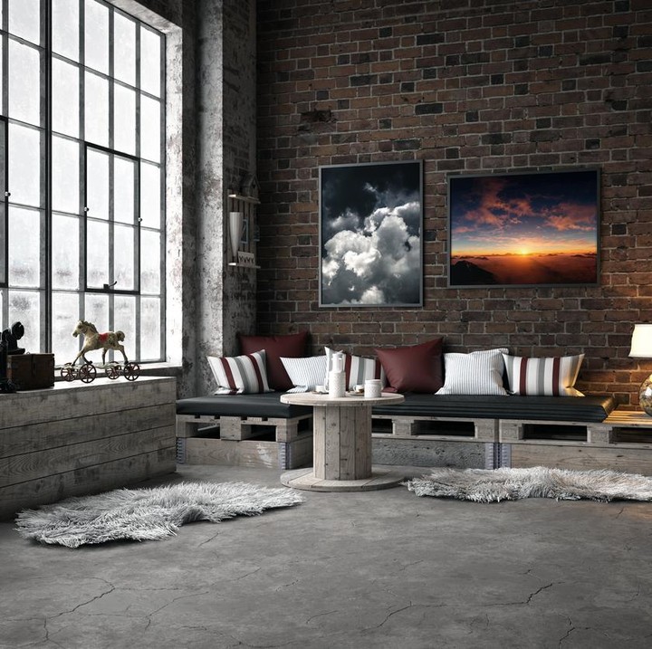 Lukisan dan furnitur hias bisa menambah kesan lebih hidup dan hangat di rumah minimalis gaya industrial. (Foto: iStock)