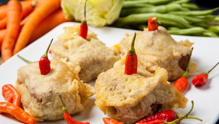 Sliced Fried Tofu with chilli and vegetables, traditional indonesian food