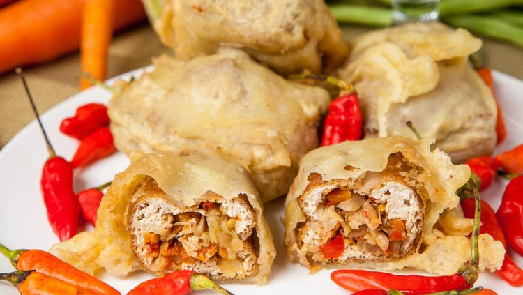 tahu jeletot Sliced Fried Tofu with chilli and vegetables, traditional indonesian food
