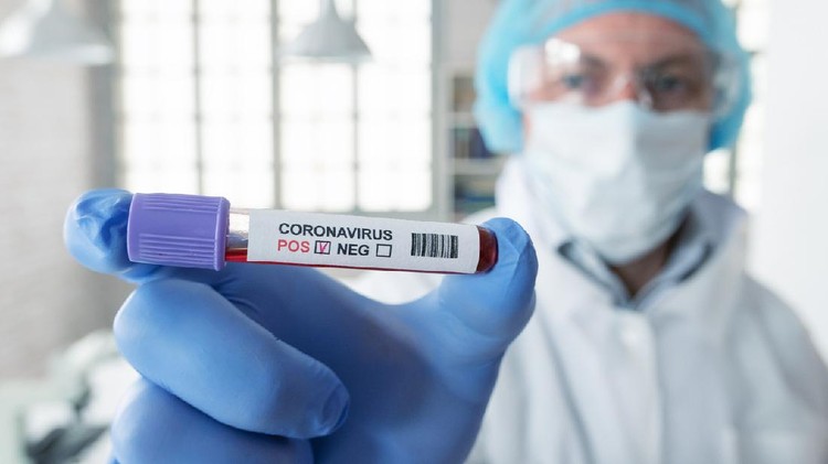 Man and woman, senior man lying in hospital bed because of coronavirus infection, female doctor is giving medicine to a patient.