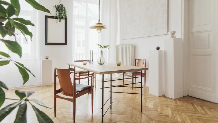 Stylish and modern dining room interior with design furniture. Eclectic decor.