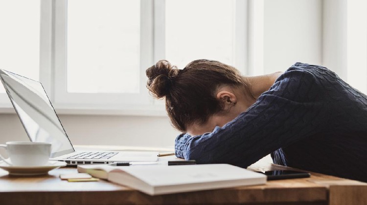 Girl sleeping during work at the office