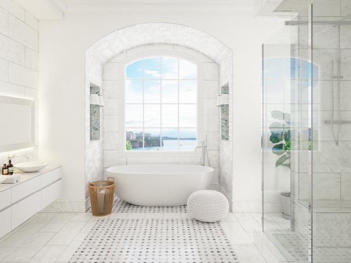 Interior of a contemporary bathroom with washstand and bathtube.
