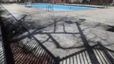 musim panas yang suram The swimming pool at Chicago's Altgeld Park remains empty as shelter at home and social distancing orders remain in affect Tuesday, April 28, 2020. From Cape Cod to California, festivals are being nixed, businesses in tourist havens are looking at empty reservation books, and people who have been cooped up through a dismal spring are worrying summer will bring just more of the same. (AP Photo/Charles Rex Arbogast)