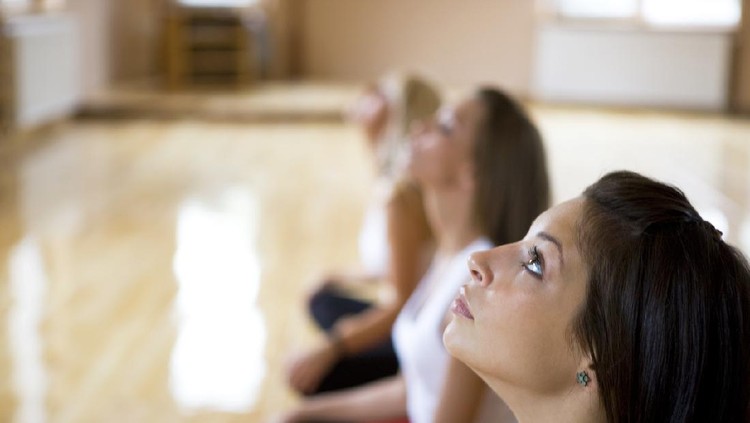 Young attractive woman doing breath therapy.
