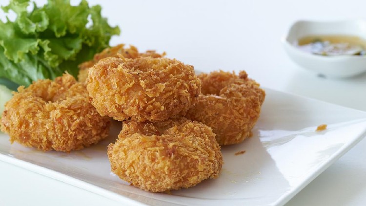 fried shrimp with flour pancake on plate in restaurant, on white background, Thai food.