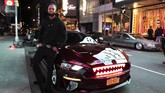 Tanpa Kemacetan Kolektor Mobil Mewah Ambil Alih Times Square In this Saturday, May 2, 2020 photo, Andre Godfrey poses with his 2018 Ford Mustang EcoBoost - - with glowing red shark teeth embedded in the grill - - in New York's Times Square during the coronavirus pandemic. Car mavens normally wouldn't dare rev their engines in Midtown, but now they're eagerly driving into the city to take photos and show off for sparse crowds walking through the commercial hub. (AP Photo/Mark Lennihan)