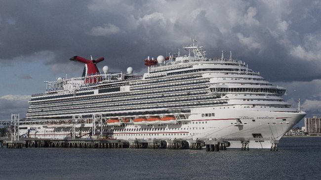 (FILES) In this file photo taken on March 7, 2020 A Carnival Panorama cruise ship is seen docked in Long Beach, California on, as passengers await onboard for the results of a COVID-19 (Coronavirus) test given to an ill passenger. - Carnival Cruise Line announced on May 4, 2020 that it will resume limited operations from Florida and Texas on August 1 after halting cruises because of the coronavirus pandemic which left some passengers trapped on its ships for weeks. (Photo by Mark RALSTON / AFP)