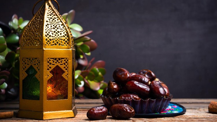 Dates and Arabic style lamp on a table with copy space